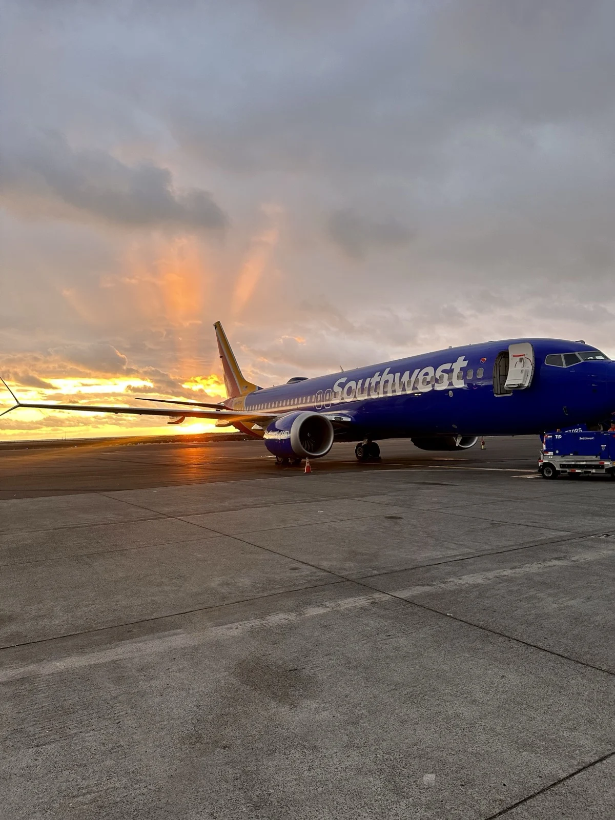 Sunset on the tarmac. The trip starts the moment you decide to protect it. | A plane on the runway at golden hour, illustrating sober air travel and airport tips from Zac Spowart, Nomadic Addictt. Sunset on the tarmac. The trip starts the moment you decide to protect it. | A plane on the runway at golden hour, illustrating sober air travel and airport tips from Zac Spowart, Nomadic Addictt.
