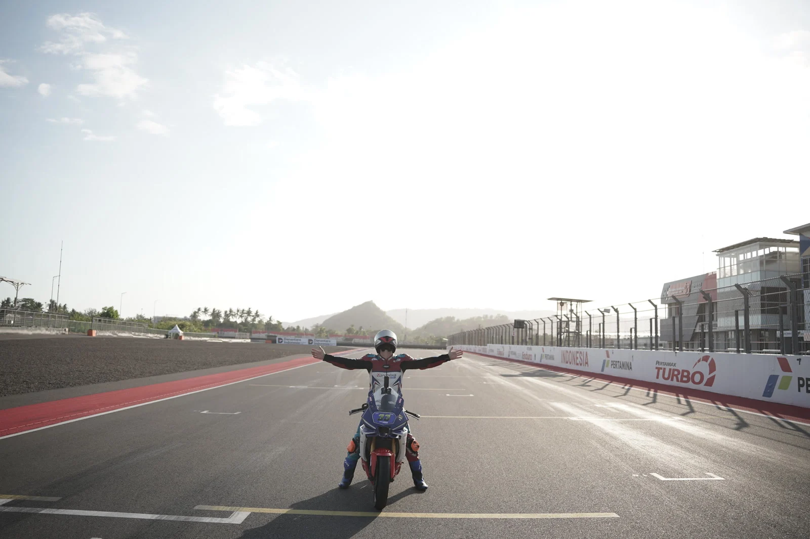 Me with my arms wide open on the main straight at Mandalika circuit